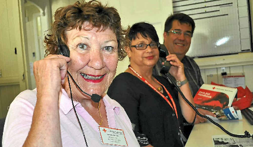 Warwick Red Cross secretary Kate Keogh, client co-ordinator Megan Shirley and Warwick branch president Neil Meiklejohn in their inaugural TeleChat day yesterday.